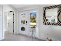 Bright entryway features a stylish mirror and front door with unique window design at 505 65Th St, Holmes Beach, FL 34217