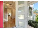 View from front doorway looking into foyer with hardwood floors and staircase at 515 S Osprey Ave, Sarasota, FL 34236