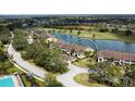 Aerial view of the condo complex with a beautiful pond and golf course view at 5251 Mahogany Run Ave # 526, Sarasota, FL 34241