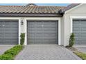 Attached two-car garage with paver driveway at 5721 Palmer Cir # 205, Lakewood Ranch, FL 34211