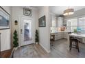 Inviting foyer featuring an ornate front door with decorative glass and views of the bright craft room at 6912 Playa Bella Dr, Bradenton, FL 34209