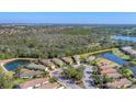 Scenic aerial view of the community, showcasing the neighborhood's serene lakes and landscaping at 7103 Westhill Ct, Lakewood Ranch, FL 34202