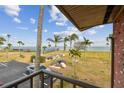 Water view from the property showing palm trees and recreational area at 2 Causeway Blvd # 206, Dunedin, FL 34698