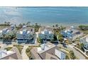 Aerial view of waterfront community, showcasing the neighborhood's layout and water access at 272 Saint Lucia Dr # 101, Bradenton, FL 34209