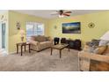 Living room with two sofas, coffee table, and large TV at 431 Gris Sky Ln, Bradenton, FL 34212