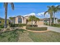 Charming single-story home featuring a two-car garage and well-manicured landscaping at 4969 Creekside Trl, Sarasota, FL 34243