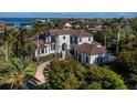 Beautiful waterfront estate featuring lush landscaping and impressive architectural details at 500 Harbor Point Rd, Longboat Key, FL 34228