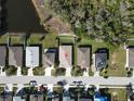 Aerial view of the home, showcasing its location in a neighborhood near a pond and green spaces at 5718 Broad River Run, Ellenton, FL 34222