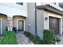 Inviting front entrance with brick pavers, landscaping, and covered entryway at 7212 Ketch Pl, Bradenton, FL 34212