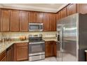 Well-equipped kitchen featuring stainless steel appliances and granite countertops at 7212 Ketch Pl, Bradenton, FL 34212