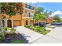 Townhome with two-car garage and manicured landscaping at 7350 Black Walnut Way, Lakewood Ranch, FL 34202