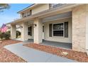 Covered front porch with stone columns and a walkway at 7805 Capwood Ave, Temple Terrace, FL 33637