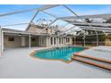 Inviting pool with covered patio and spa at 7805 Capwood Ave, Temple Terrace, FL 33637