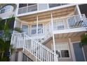 White railings and stairs leading to condo entrances at 850 S Tamiami Trl # 724, Sarasota, FL 34236