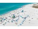 Scenic beach bustling with people, turquoise water, and soft white sand at 8737 Daydream St, Sarasota, FL 34238