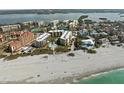 Aerial view of beachfront condo community with white sand beach at 8767 Midnight Pass Rd # 505F, Sarasota, FL 34242