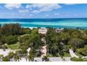Oceanfront estate with lush landscaping and large pool at 1067 Westway Dr, Sarasota, FL 34236