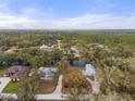 Scenic aerial view of a residential neighborhood featuring homes along a winding river at 27350 San Carlos Dr, Punta Gorda, FL 33983