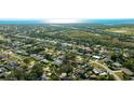 Beautiful aerial view of the neighborhood showcasing the property's location near the water and lush greenery at 2760 Siesta Dr, Venice, FL 34293