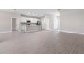 Open concept living space with tile floors, neutral walls, and a view of the kitchen at 3166 Cabo St, North Port, FL 34291
