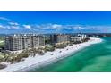 Luxury beachfront condos boast clear turquoise waters and a pristine white sand beach at 435 L Ambiance Dr # L807, Longboat Key, FL 34228