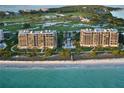 Beautiful beachfront condos with a pool, lush landscaping, and direct beach access at 435 L Ambiance Dr # L807, Longboat Key, FL 34228