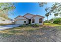 Inviting single story home with landscaped front yard and attached garage at 4920 82Nd E Pl, Sarasota, FL 34243