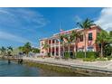 Elegant clubhouse with waterfront views, American flag, and outdoor picnic area at 5282 Beach Se Dr # D, St Petersburg, FL 33705