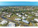 Aerial view of neighborhood with nearby ocean and lakes, showing the home's location within the community at 536 Miro Cir # 536, Nokomis, FL 34275