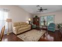 Bright living room with hardwood floors, large window, and neutral-colored sofa at 5441 18Th W Ct, Bradenton, FL 34207