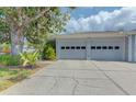 Spacious two-car garage with modern doors and a clean concrete driveway at 6517 Approach Rd # 57, Sarasota, FL 34238