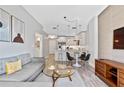 Modern living room featuring contemporary decor, with a partial view of the kitchen at 1500 State St # 305, Sarasota, FL 34236