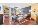 Comfortable living room featuring modern decor, sliding glass doors, and hardwood floors at 1771 Ringling Blvd # 703, Sarasota, FL 34236