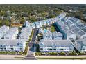 Aerial view of modern townhomes with community pool and meticulously landscaped neighborhood at 405 Gowdy Rd, Sarasota, FL 34237