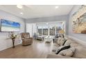 Comfortable living room with a beach-themed design and scenic outside views at 4390 Exeter Dr # I305, Longboat Key, FL 34228