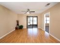 Inviting living area with wood floors, fan, and ample natural light creating a warm and spacious ambiance at 5315 11Th Street E Cir # 5315, Bradenton, FL 34203