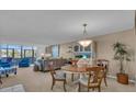 Inviting living room with comfortable seating, bright windows, and neutral tones at 6263 Midnight Pass Rd # 105, Sarasota, FL 34242