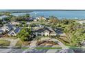 Expansive aerial view of a waterfront home, showcasing the property's prime location and lush surroundings at 7912 Desoto Memorial Hwy, Bradenton, FL 34209