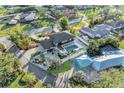 Aerial view of a luxurious home featuring a swimming pool, manicured grounds, and serene surroundings at 7912 Desoto Memorial Hwy, Bradenton, FL 34209