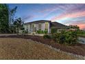 Stunning two-story home boasting large windows, stone accents, and mature landscaping in a desirable neighborhood at 7912 Desoto Memorial Hwy, Bradenton, FL 34209