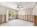 Bedroom featuring a sliding glass door to the yard, large windows, and a ceiling fan at 1719 New Hampshire Ne Ave, St Petersburg, FL 33703