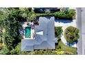 Aerial view of home showcasing pool, patio, and lush landscaping at 1735 Flower Dr, Sarasota, FL 34239