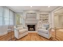 Inviting living room with a fireplace and built-in shelving at 1919 Irving St, Sarasota, FL 34236