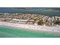 Beautiful aerial view of beachfront condos, turquoise water, and sandy beach at 224 17Th St # 224, Bradenton Beach, FL 34217