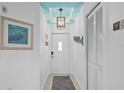 Bright entryway featuring stylish decor, a unique light fixture, and neutral walls at 224 17Th St # 224, Bradenton Beach, FL 34217