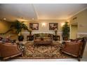 Well-decorated lobby featuring comfortable seating, tropical plants and elegant decor at 2755 Coconut Bay Ln 1K # 119, Sarasota, FL 34237