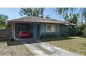 Inviting home showcasing a covered carport and a tidy front yard, presenting a welcoming appearance at 2784 Martin St, Sarasota, FL 34237