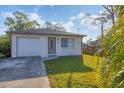 Charming single-story home featuring a well-manicured lawn, and attached single car garage at 3311 19Th E St, Bradenton, FL 34208