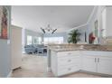 Bright living room with open floor plan, coastal decor, and granite countertops at 3404 79Th Street W Cir # 301, Bradenton, FL 34209