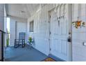 Balcony area with rocking chair outside the front door at 5855 Palm Ln # B21, Bradenton, FL 34207